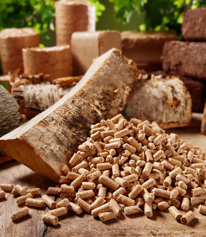 High,Angle,Of,Wood,Cylindrical,Pellets,Scattered,On,Timber,Table